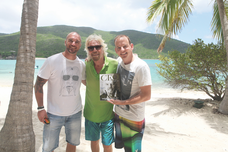 Daniel Di Loreto, Richard Branson, and Chris Dutton with an autographed copy of The CEO Magazine