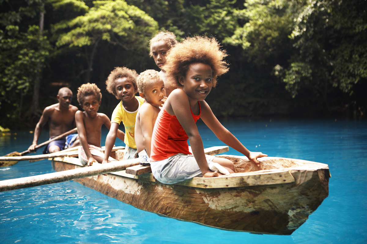 Children boat at Riri Blue Hole