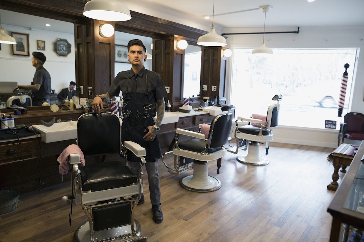 Portrait confident barber in barber shop Cut it out!