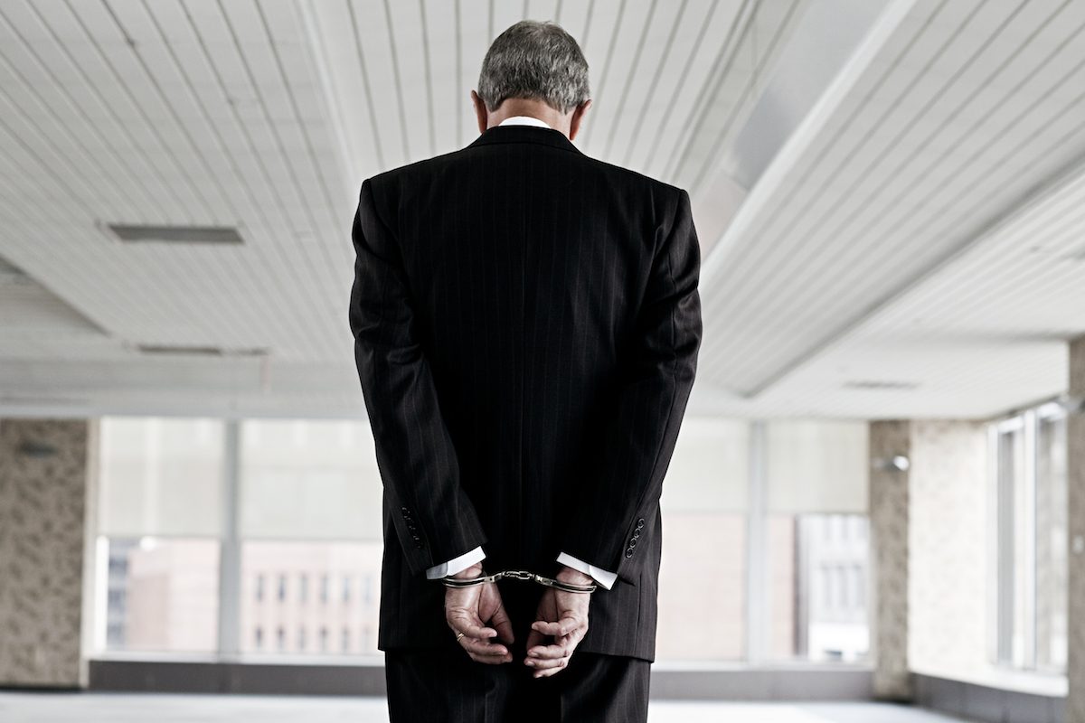Businessman in handcuffs Why white-collar criminals rarely go to gaol