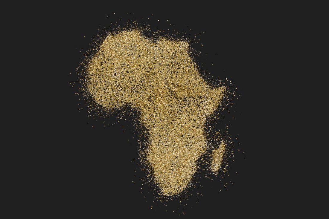 Africa shaped from golden glitter on black (series)