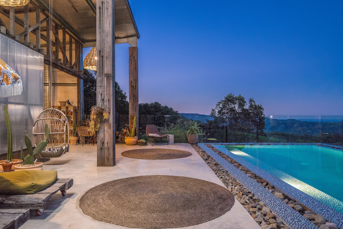 Reception and pool at night at Blackbird Byron
