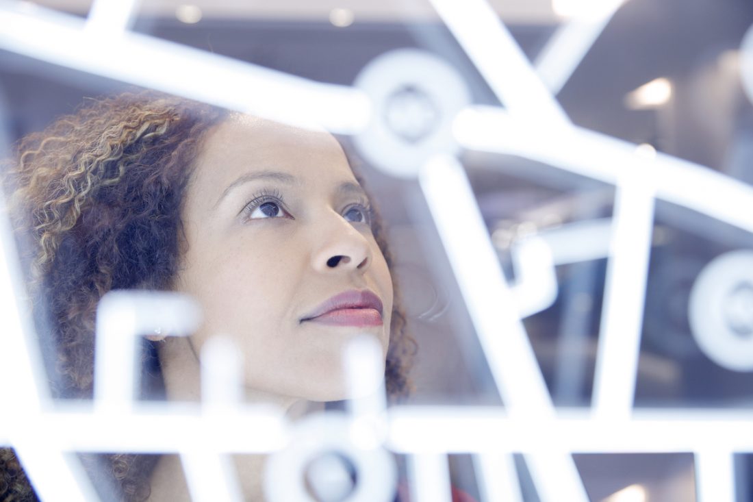 Portrait of woman operating digital interface technology digital transformation