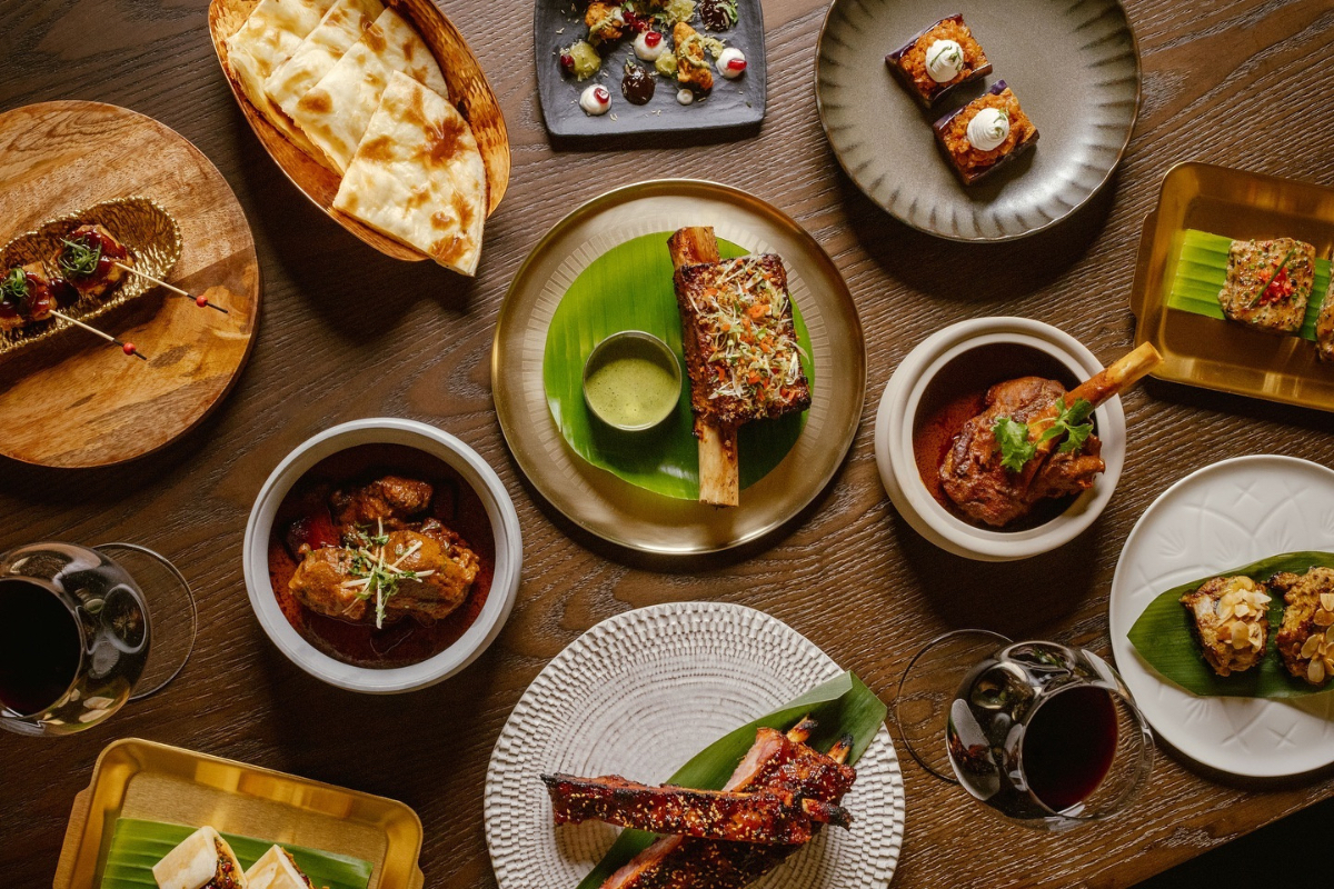 A selection of Indian-inspired platters such as naan and lamb shank